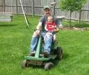 Dad and Ace Riding On The Mower