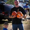 Dad and Ace Carrying The Pumpkins